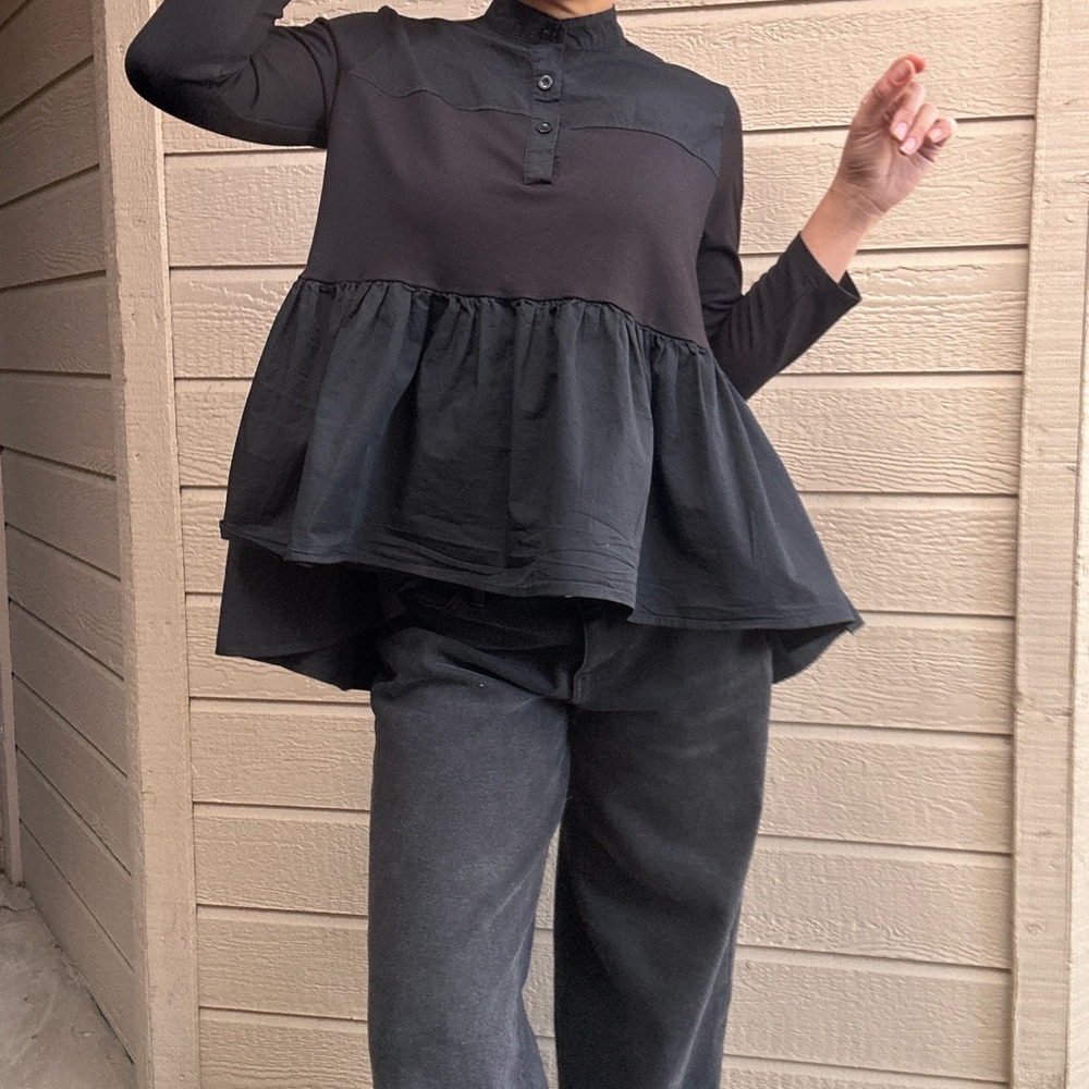 Black long sleeve with button-up front and ruffle